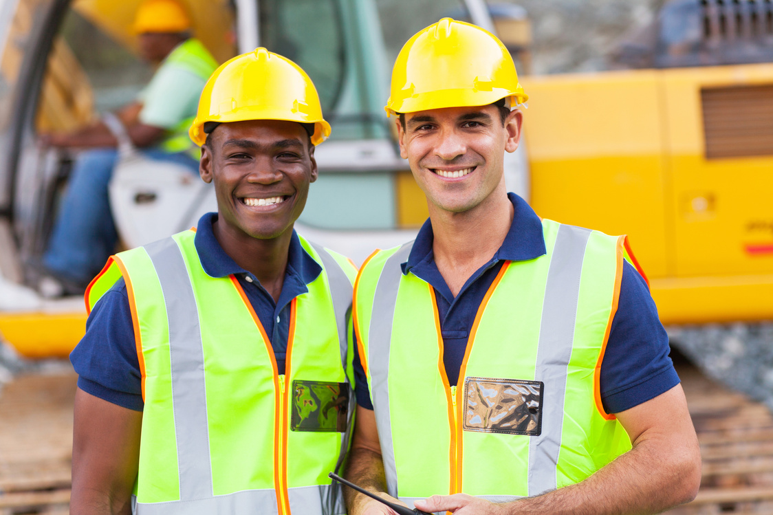 Two construction workers at work